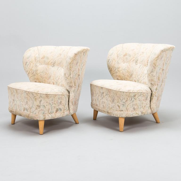 A pair of mid 20th century armchairs.