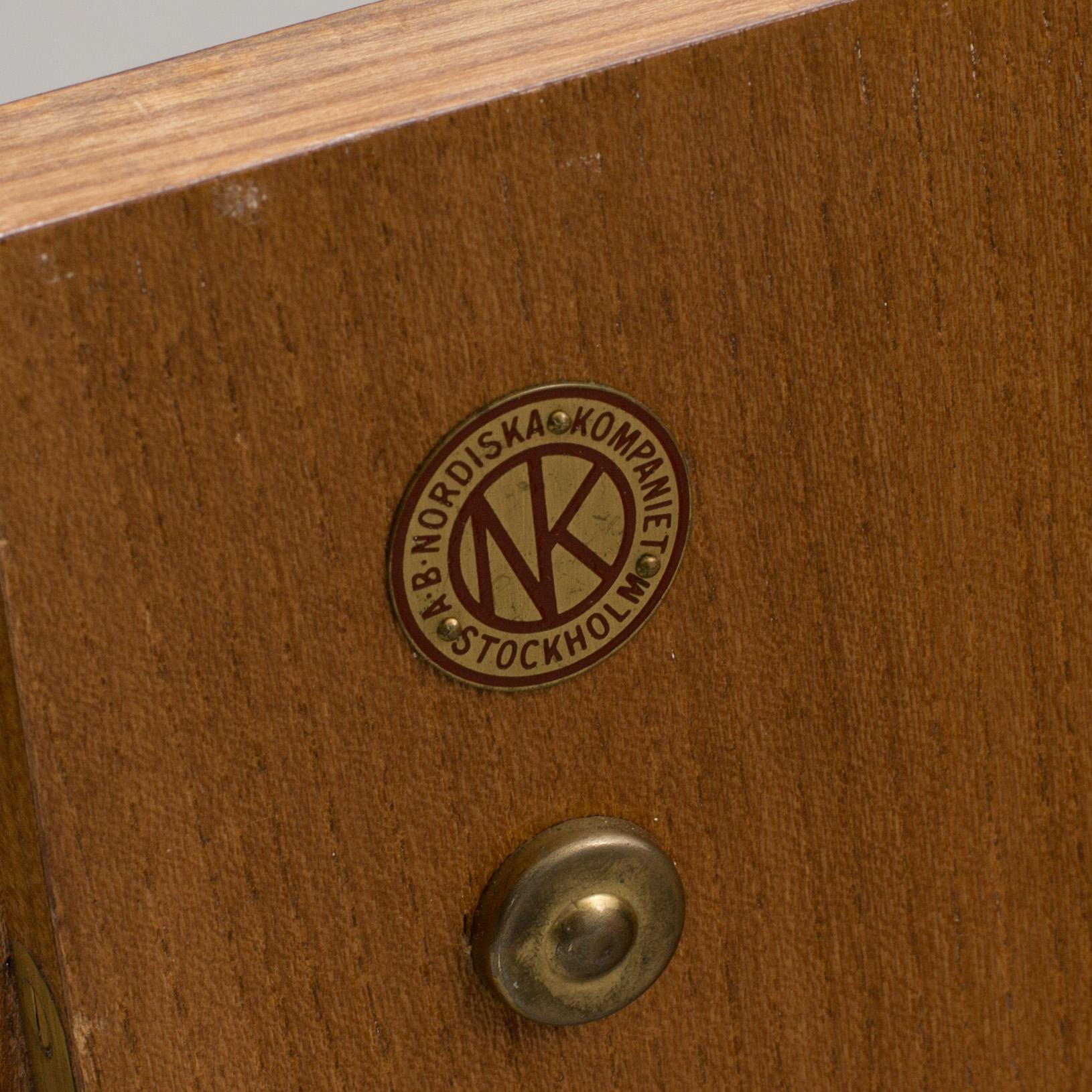 A "MODEL OK" SIDEBOARD DESIGNED BY AXEL EINAR HJORTH FOR NORDISKA KOMPANIET.