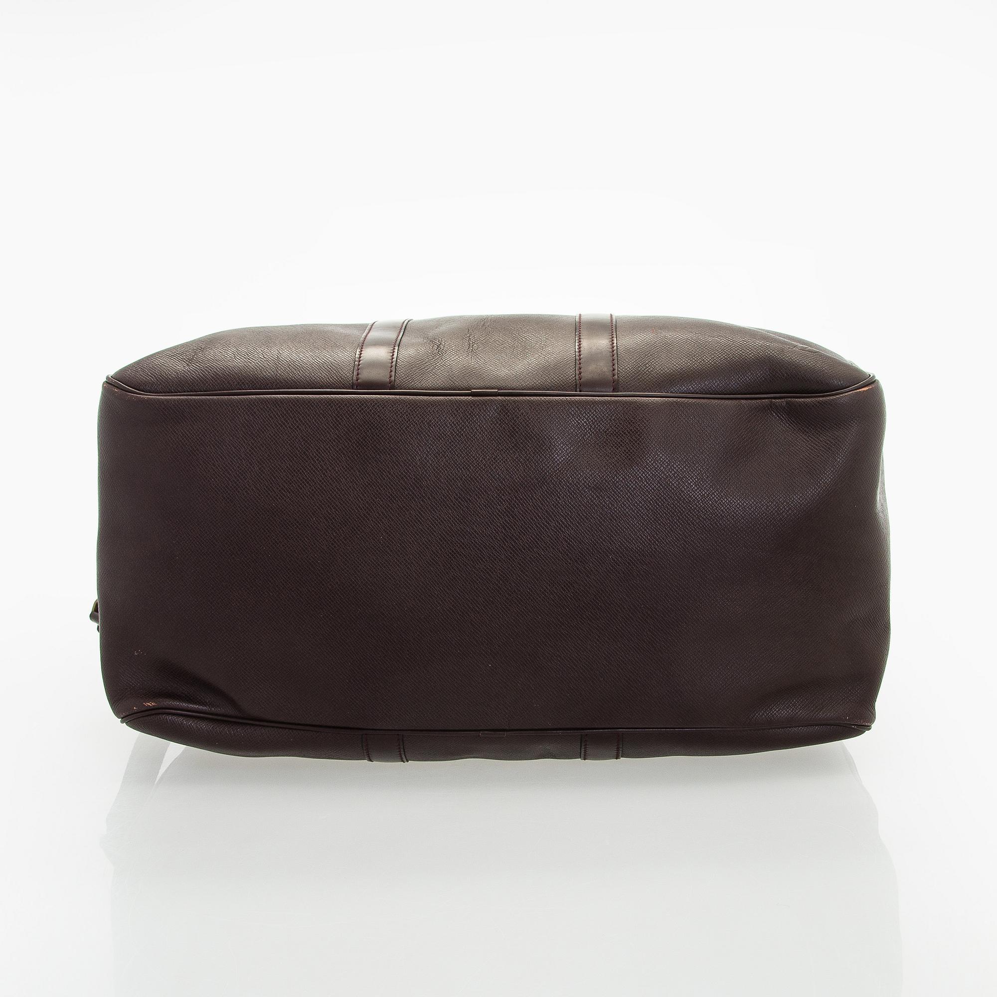 Louis Vuitton, a 'Taiga Kendall PM' weekend bag.