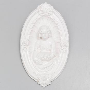 A ceramic wall relief, circa 1900.