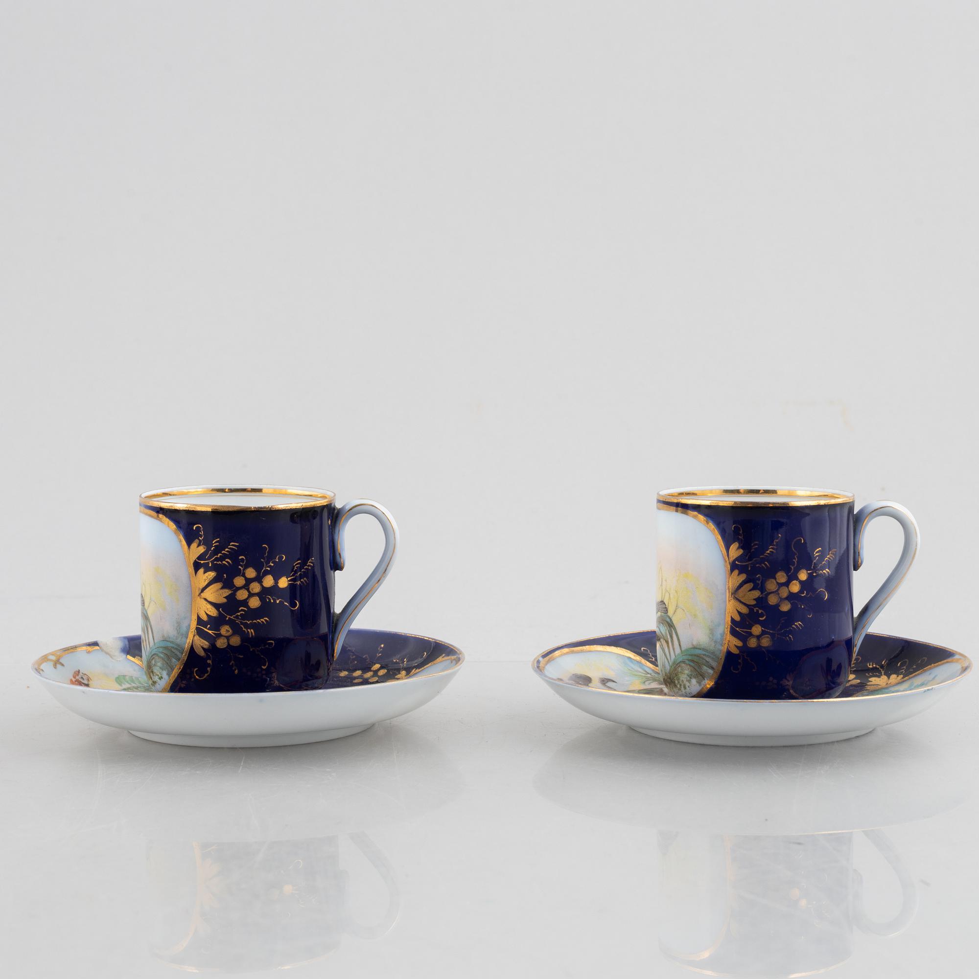 A set of nine porcelain coffee cups with saucers, Kuznetsov, Russia (1891-1917).