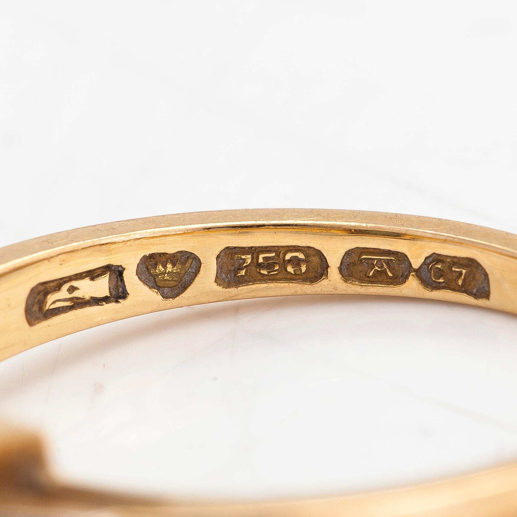 Ring, 18K guld, diamanter tot ca. 0.06 ct samt smaragd. Auran Kultaseppä Oy, Turku 1956.