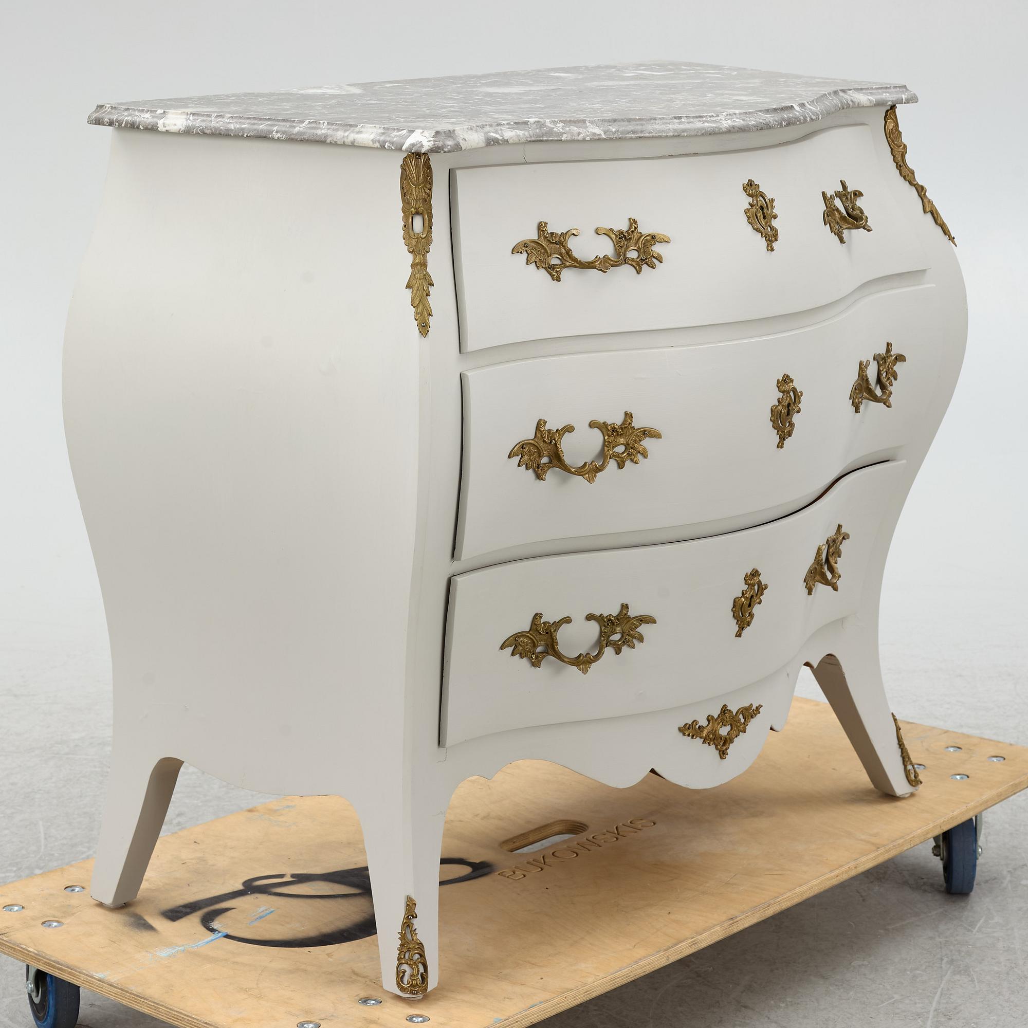 A Rococo style chest of drawers, mid-20th Century.