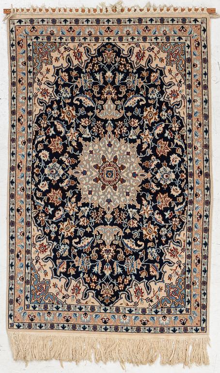 A Nain rug, part silk, c. 128 x 82 cm.