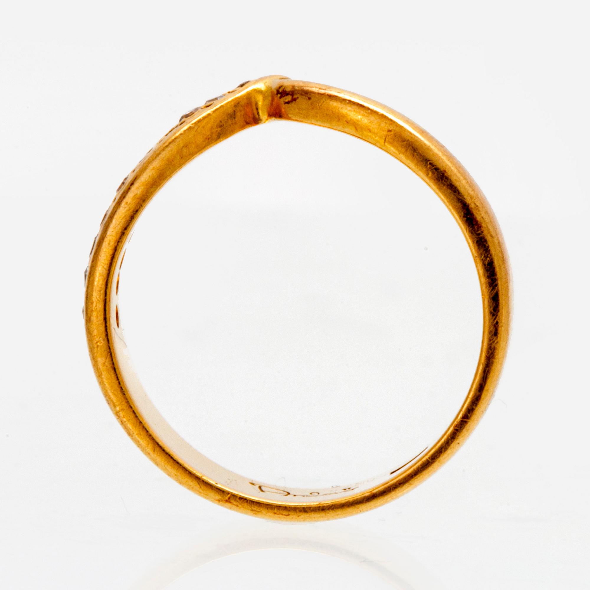An 18K gold ring with octagonal cut diamonds.