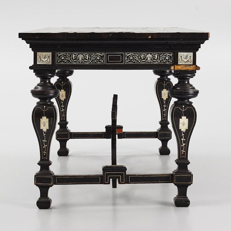 A Renaissance-style ebony, ebonized and ivory-inlaid library table, late 19th century, presumably Germany.