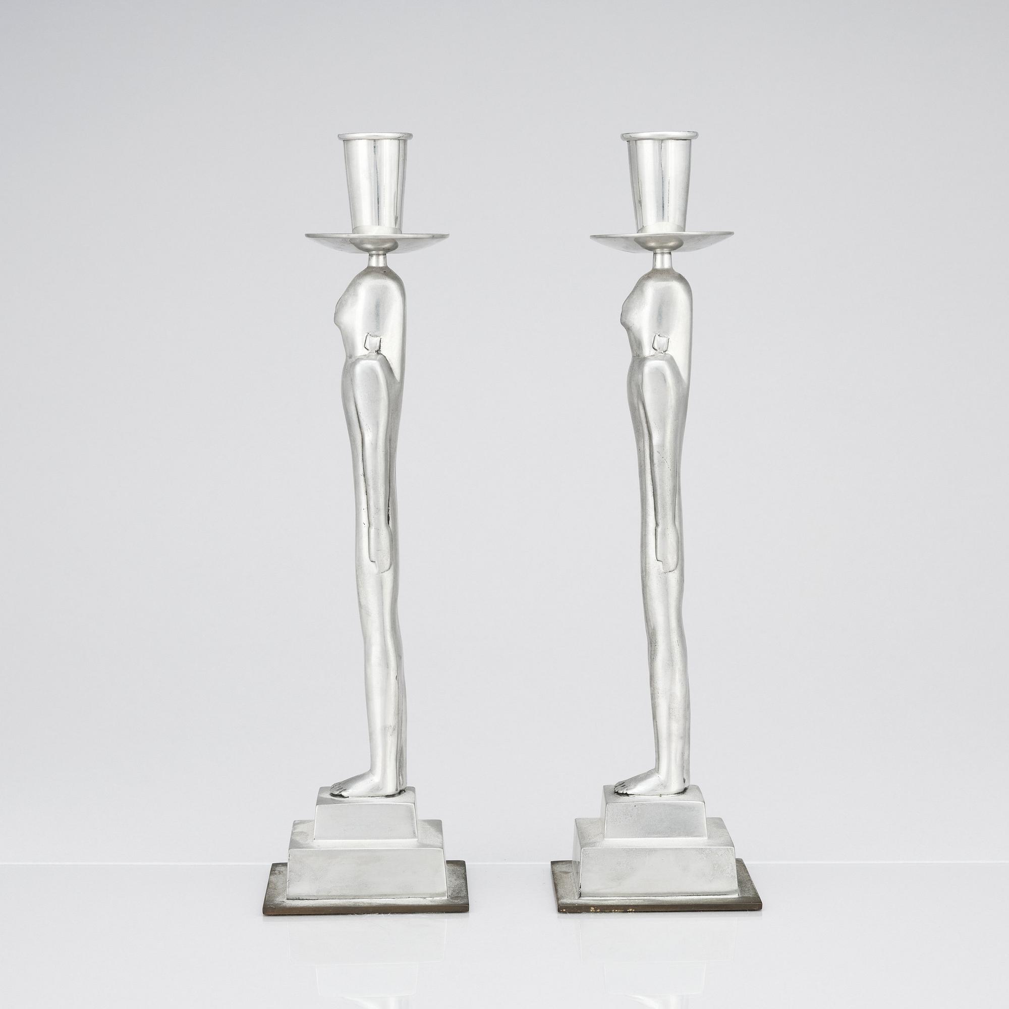 Edvin Öhrström, a pair of pewter and brass 'Egyptian' candlesticks, Svenskt Tenn, Sweden 1984.