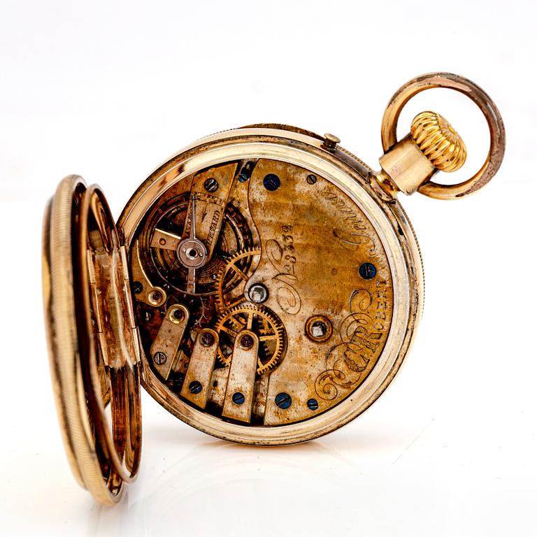 A mid 1800s gilded bronze pocket watch stand and pocket watch.