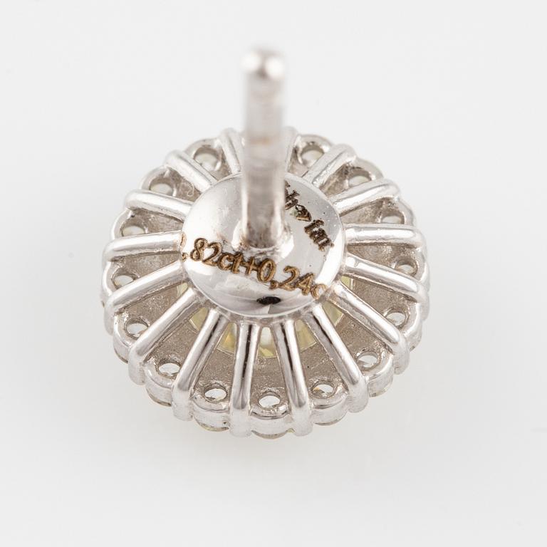 A pair of earrings in 18K white gold with round brilliant-cut diamonds.