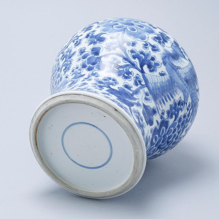 A blue and white Chinese Kangxi vase.