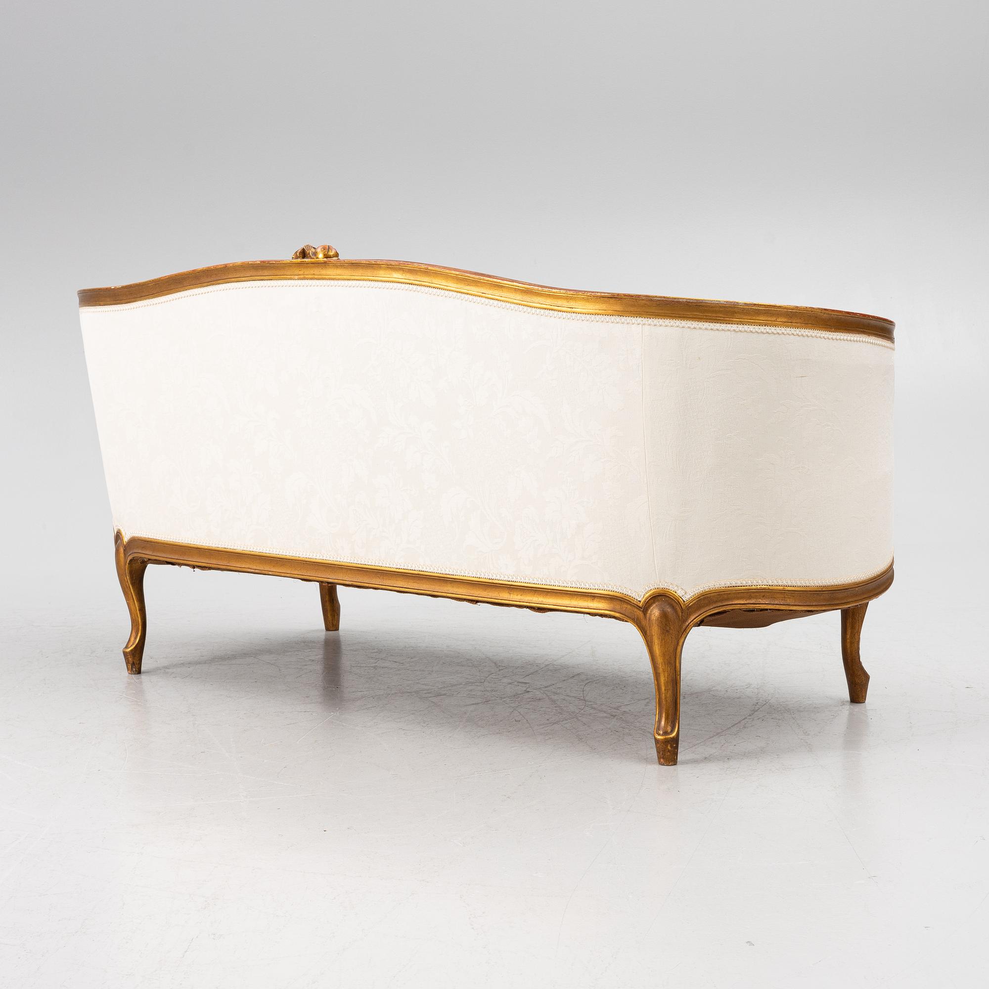 A Louis XV-style sofa, early 20th century.