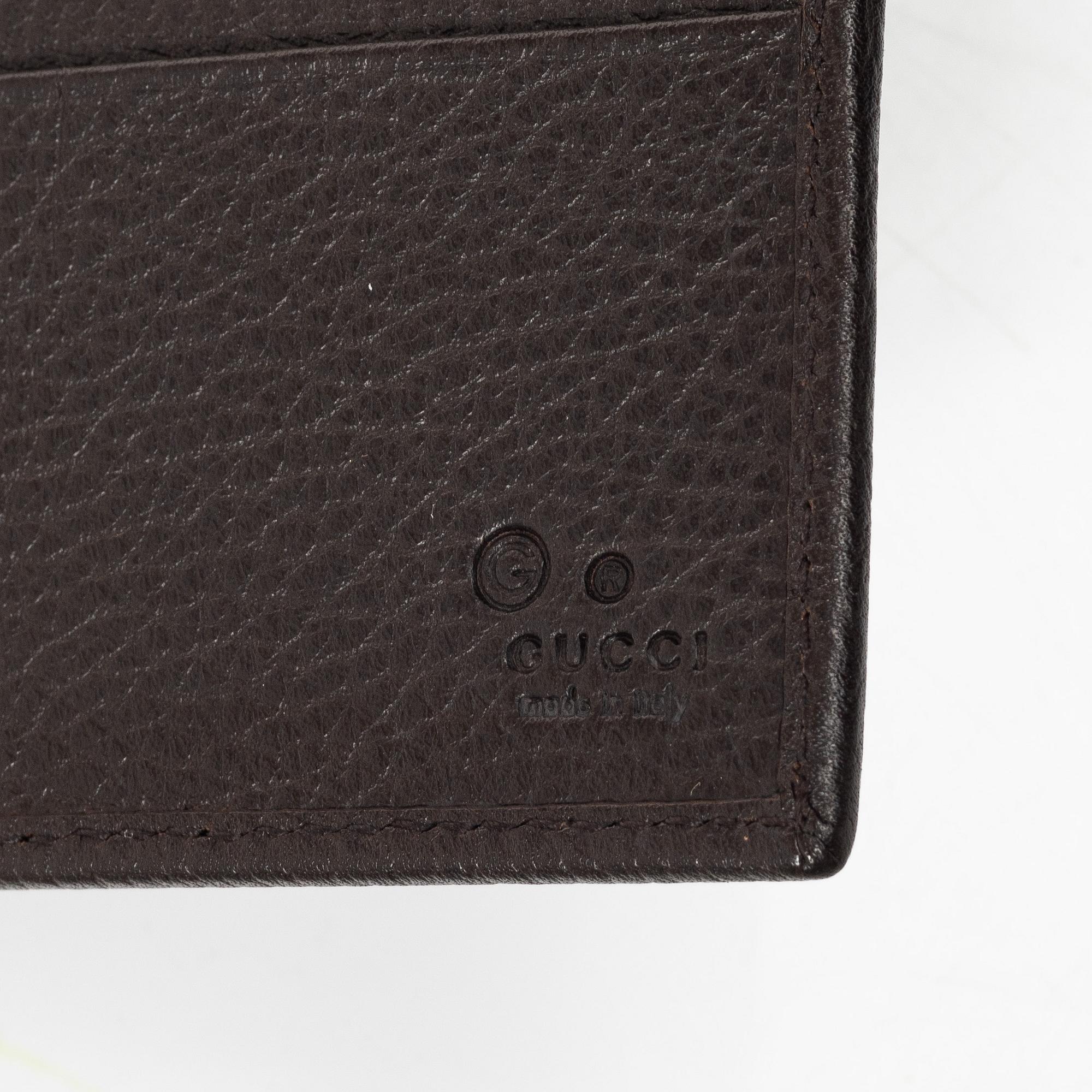 Gucci, wallet and belt.