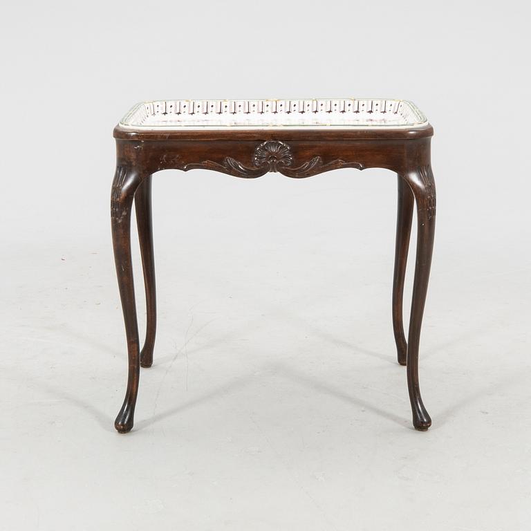 Rococo-style tea table signed and dated Rörstrand 1918 porcelain.
