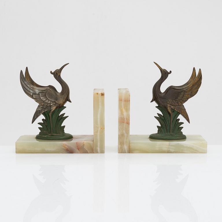 A pair of alabaster and  patinated metal Art Deco bookends from the first half of the 20th Century.