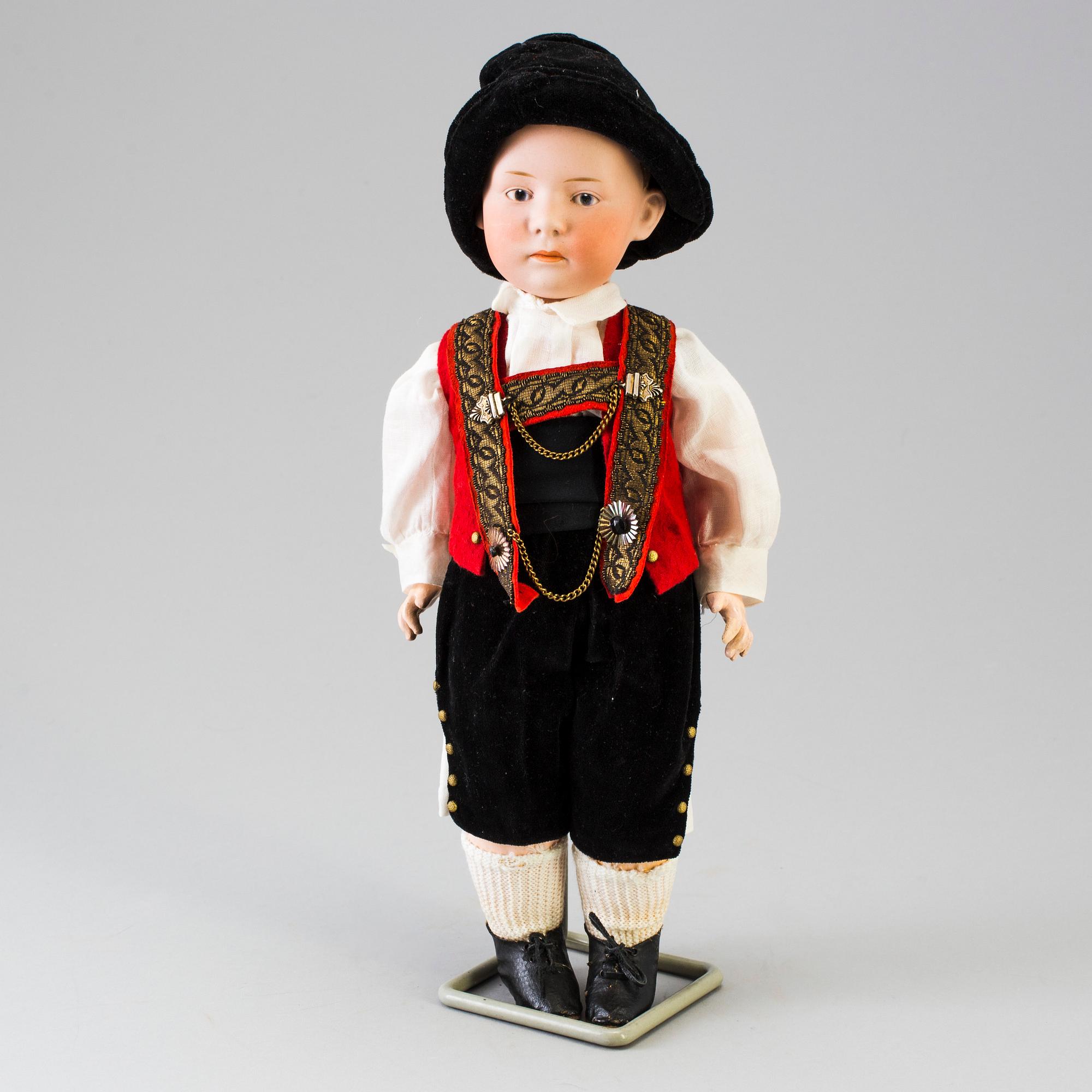 A bisque headed boy doll by Heubach, Germany, 1910s.