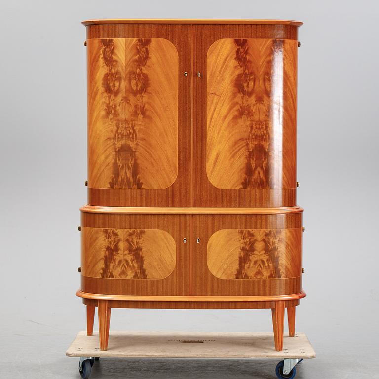 A mahogany veneered cabinet, mid 20th Century.