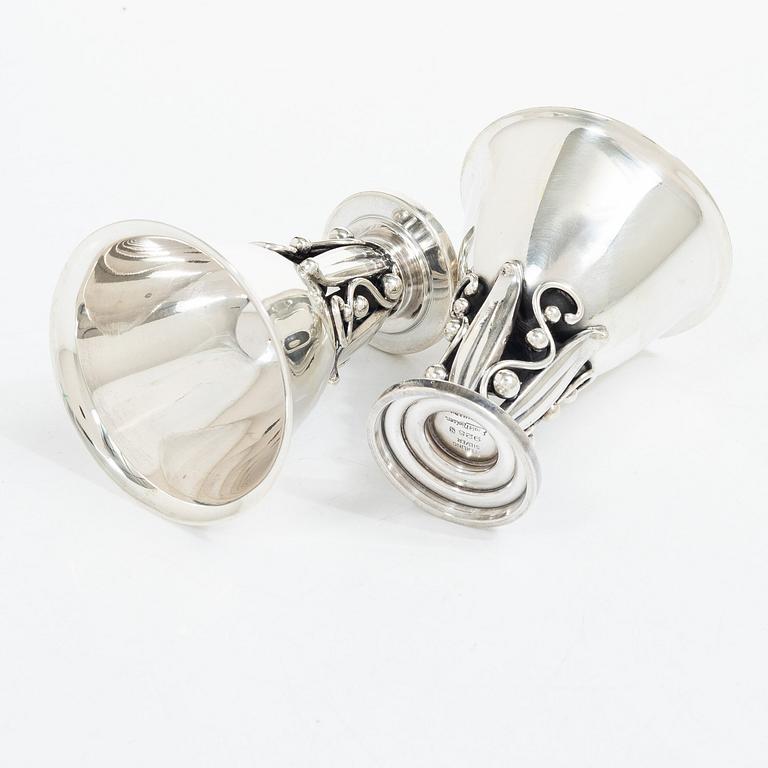 Evald Nielsen, four sterling silver beakers/cups on a foot, Denmark 20th century.