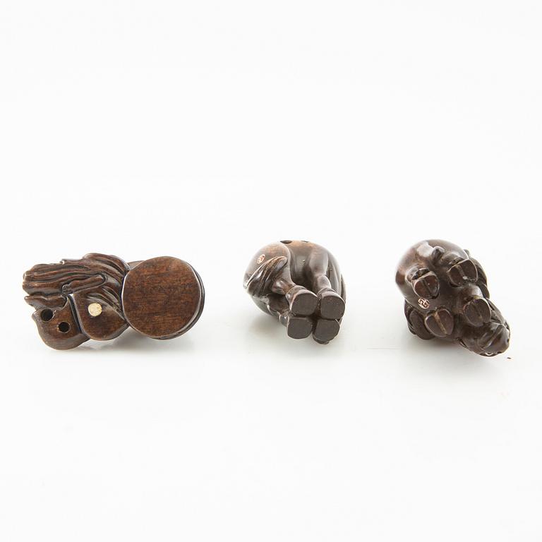 Netsuke, three pieces, boxwood. Japan, 20th century.
