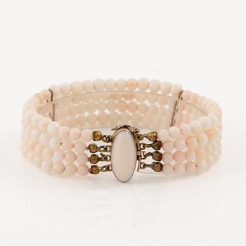 Bracelet with light pink coral, four strands.
