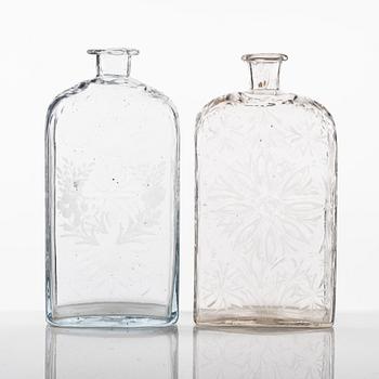 Two engraved glass bottles, late 18th Century/circa 1800.