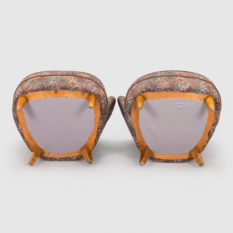 A pair of mid-20th century armchairs.