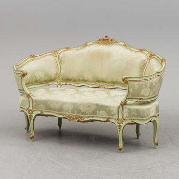 The second half of the 19th century Louis XV-style sofa.