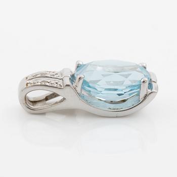Pendant in 18K gold with a topaz and small diamonds.