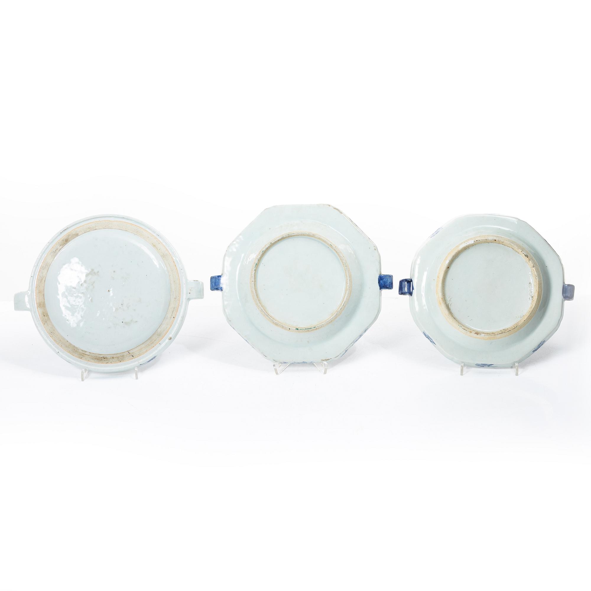 A group of three Chinese blue and white porcelain hot water dishes, Qing dynasty, 18/19th century.