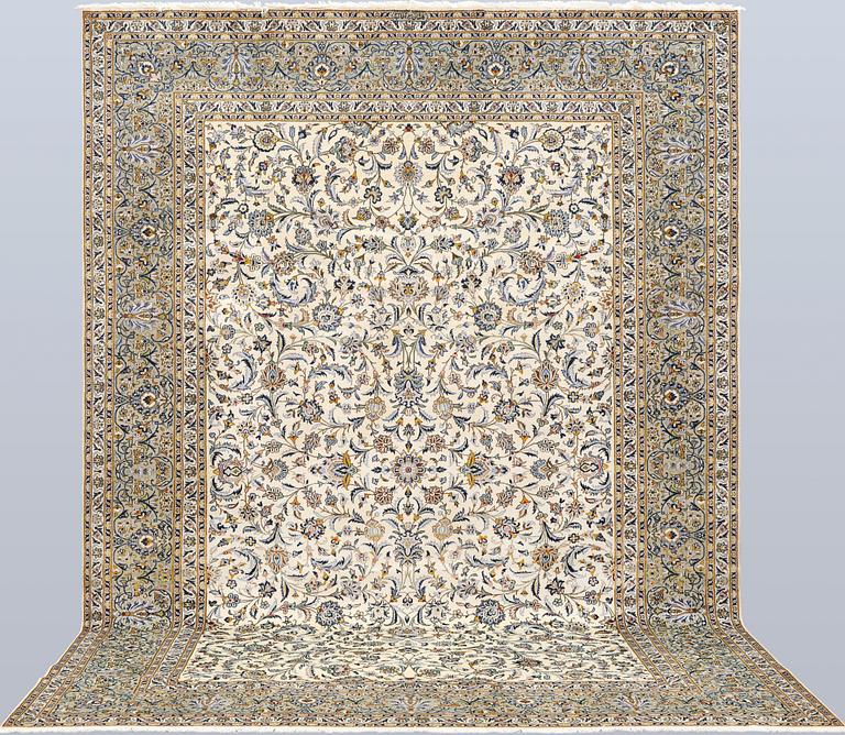 A Keshan carpet, signed, approx. 390 x 282 cm.