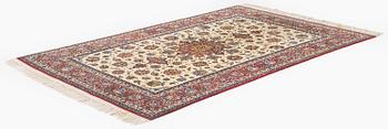 A semi-antique Isfahan rug, c. 225 x 143 cm.