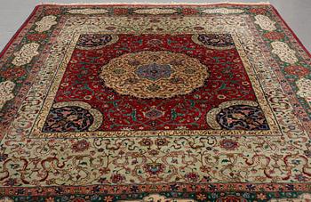 A carpet, semi-antique Tabriz, signed ca 335,5 x 256,5 - 261,5 cm.