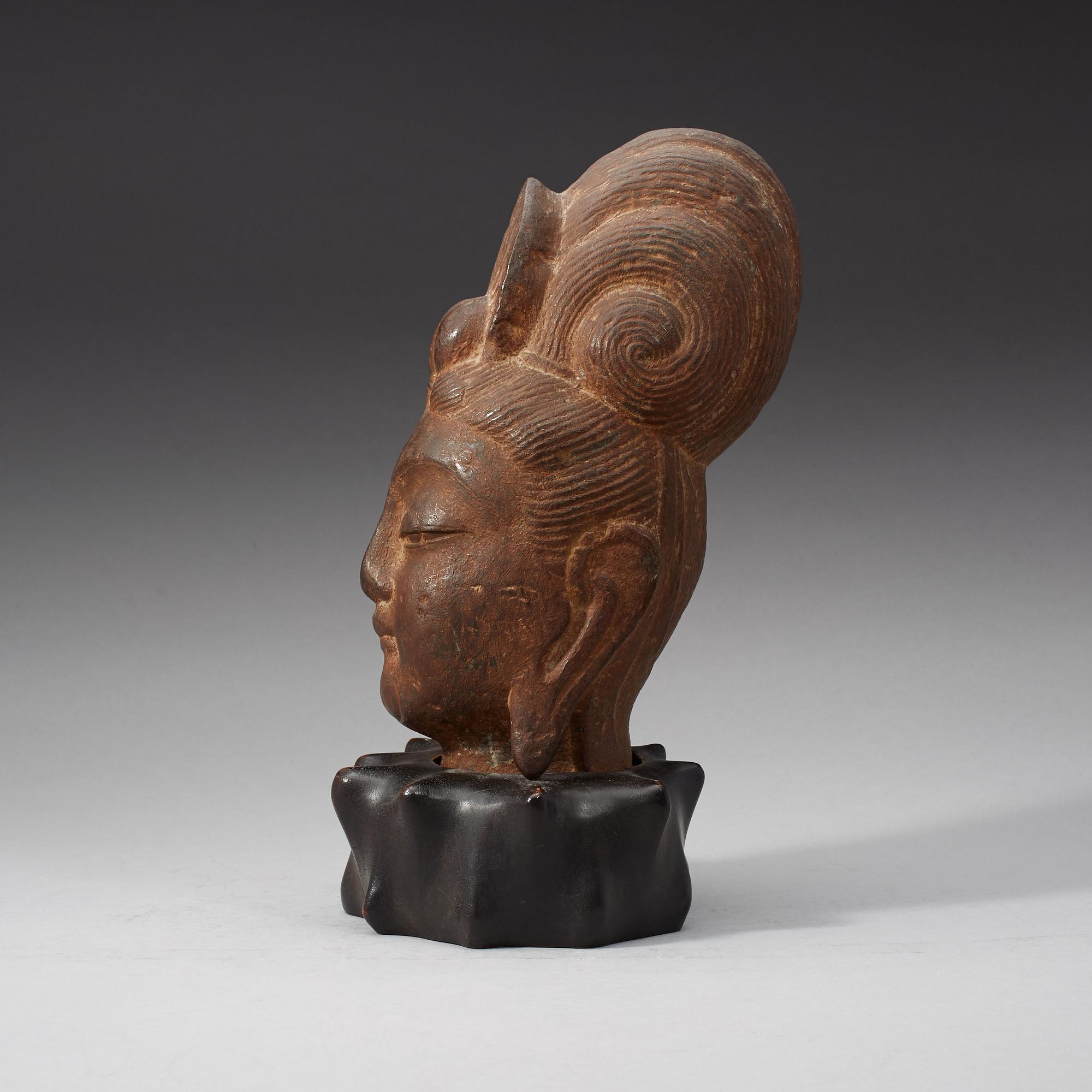A Chinese stone head of Guanyin, possibly Tangdynasty.