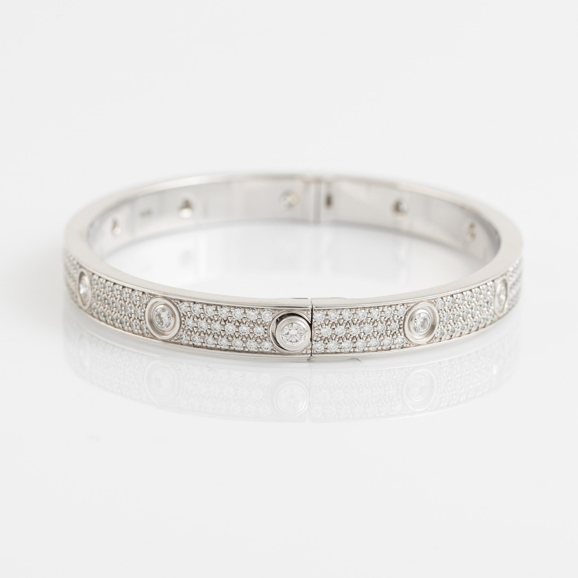 A Cartier "Love Pavé" in 18K white gold set with round brilliant-cut diamonds.
