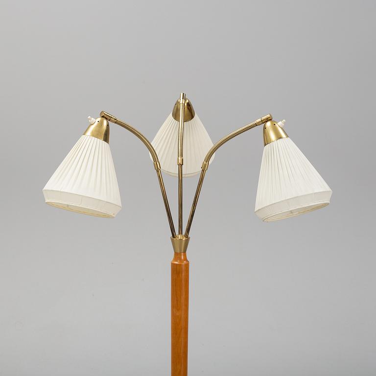 An elm floor light, mid 20th Century.
