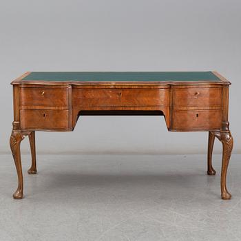 A Rococo-style circa 1900 writing desk.