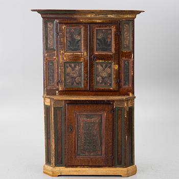 A corner cupboard, dated 1779.