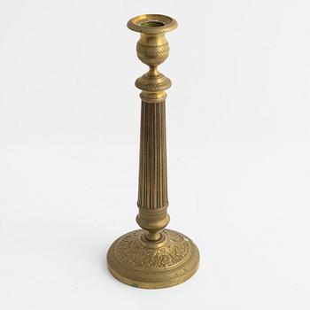 A brass Empire candlestick, first half of the 19th century,