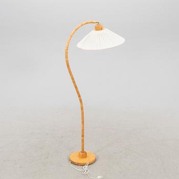 A Markslöjd 21st century wooden floor lamp.