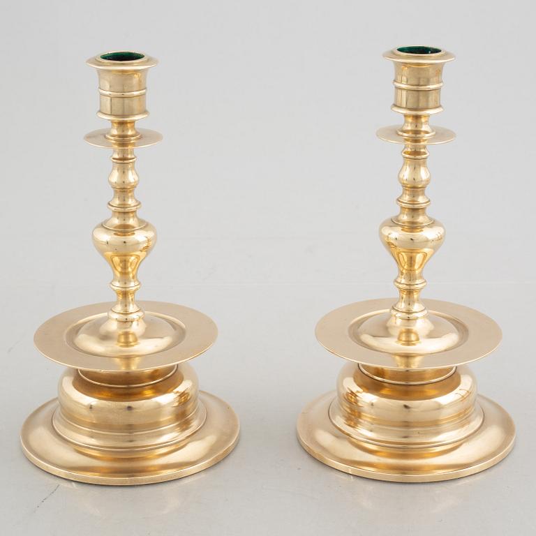Two pairs of brass candlesticks, 19th century - early 20th century.