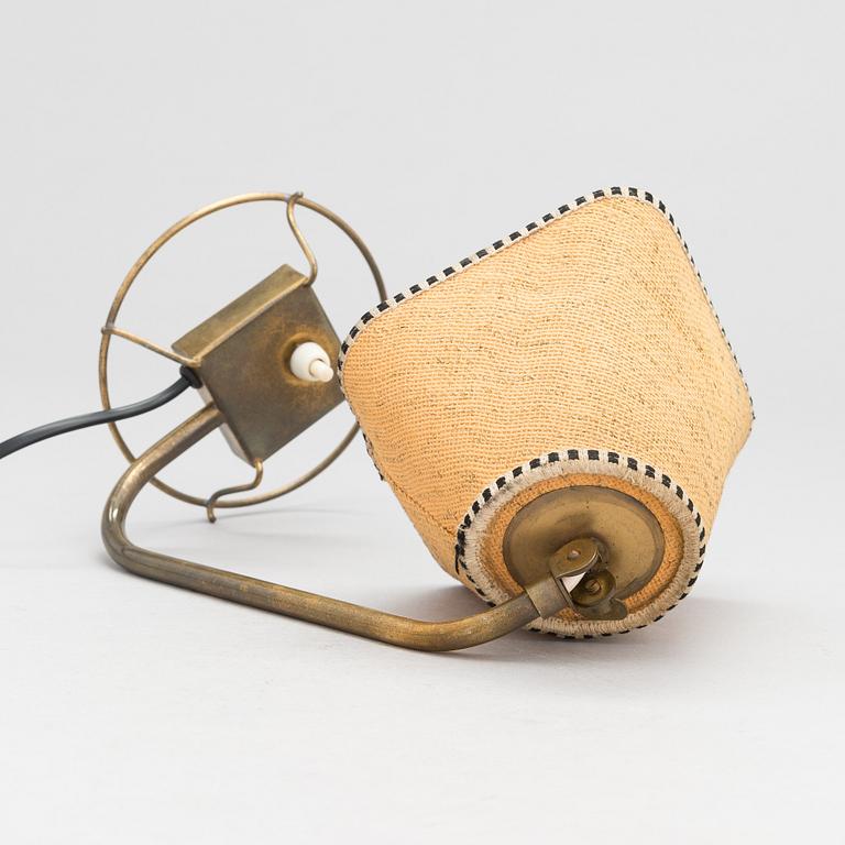 A mid-20th-century table lamp
/wall light for Idman.