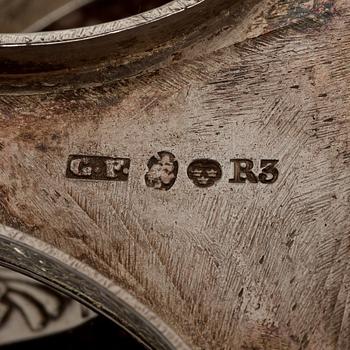 A pair of Swedish 19th century porphyry and silver salt-cellars, silver with mark of Gustaf Folcker, Stockholm 1823.