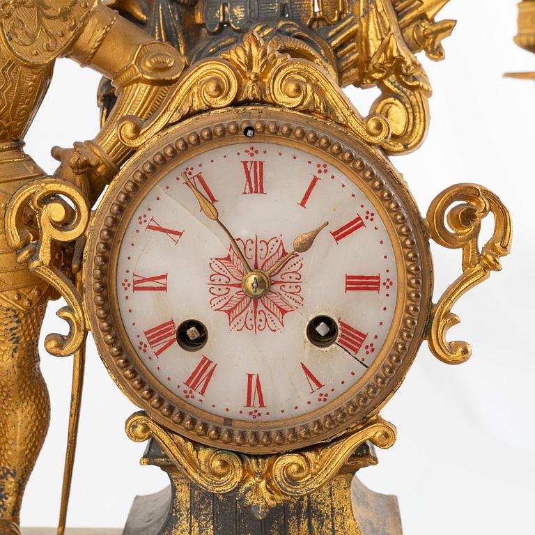 A mantel clock and a pair of candelabra, P.H. Mourey, France, late 19th Century.