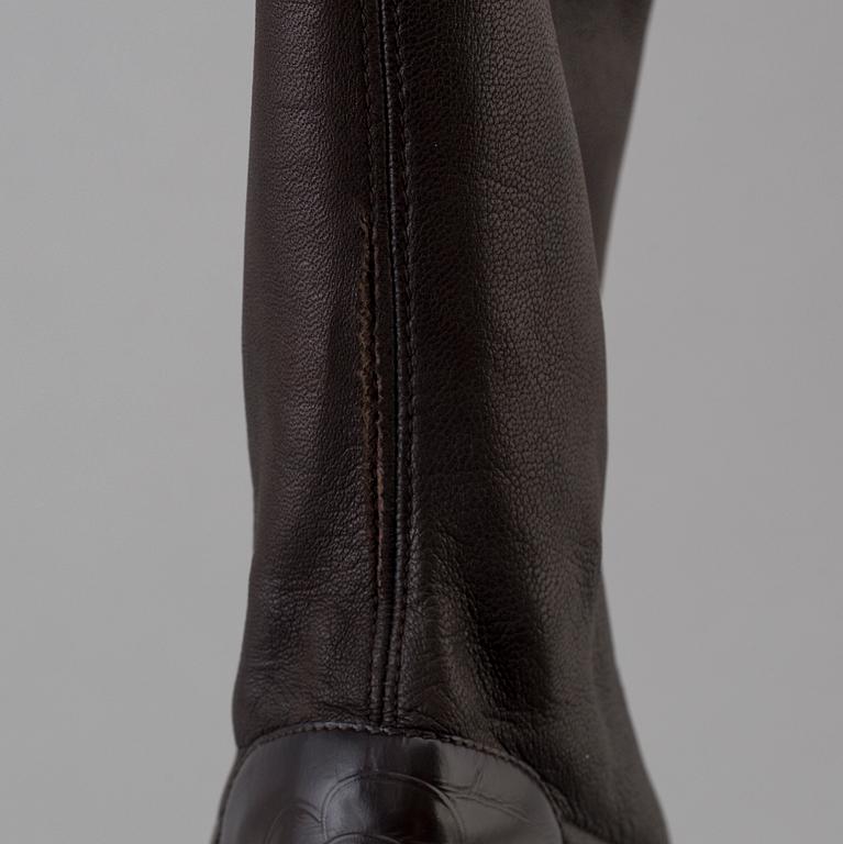 Brown leather boots by Chanel.