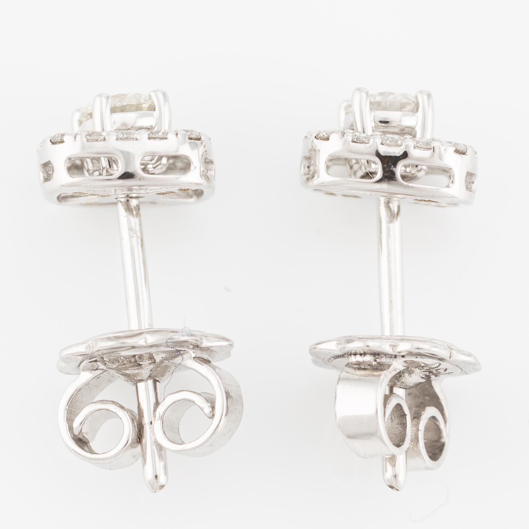 Earrings, two-part 18K white gold with brilliant-cut diamonds.
