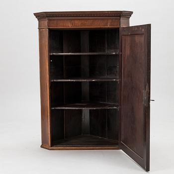 A 19th Century wall mounted corner cabinet.