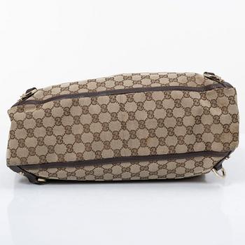 Gucci, a canvas and leather bag.