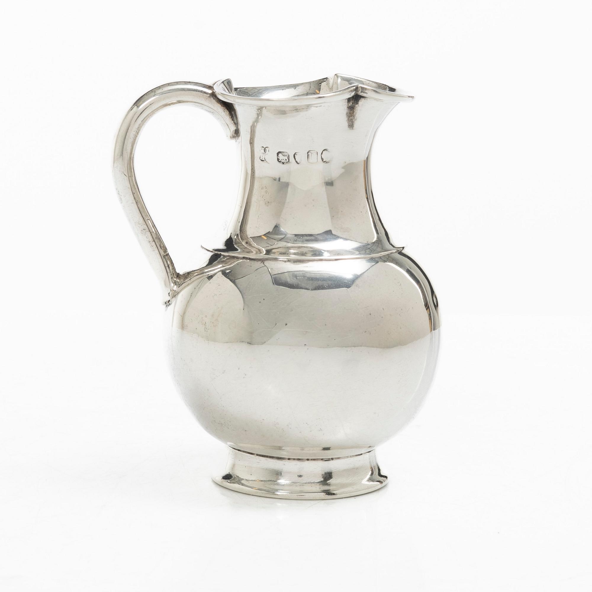 A British silver creamer, mark of Henry John Lias & Son, London 1875.