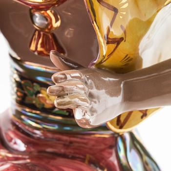 Dekorativ skulptur Sittande man med turban 1900-talets mitt/andra hälft.