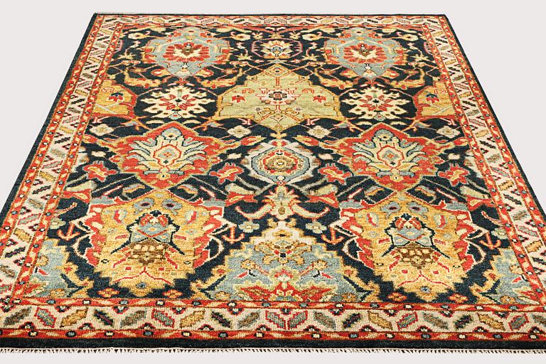 An oriental carpet with Mamluk design, a. 331 x 274 cm.
