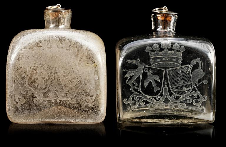 A set of eight armorial Swedish flasks, two baroque, presumably Kungsholms glasbruk, six later, 19th Century.